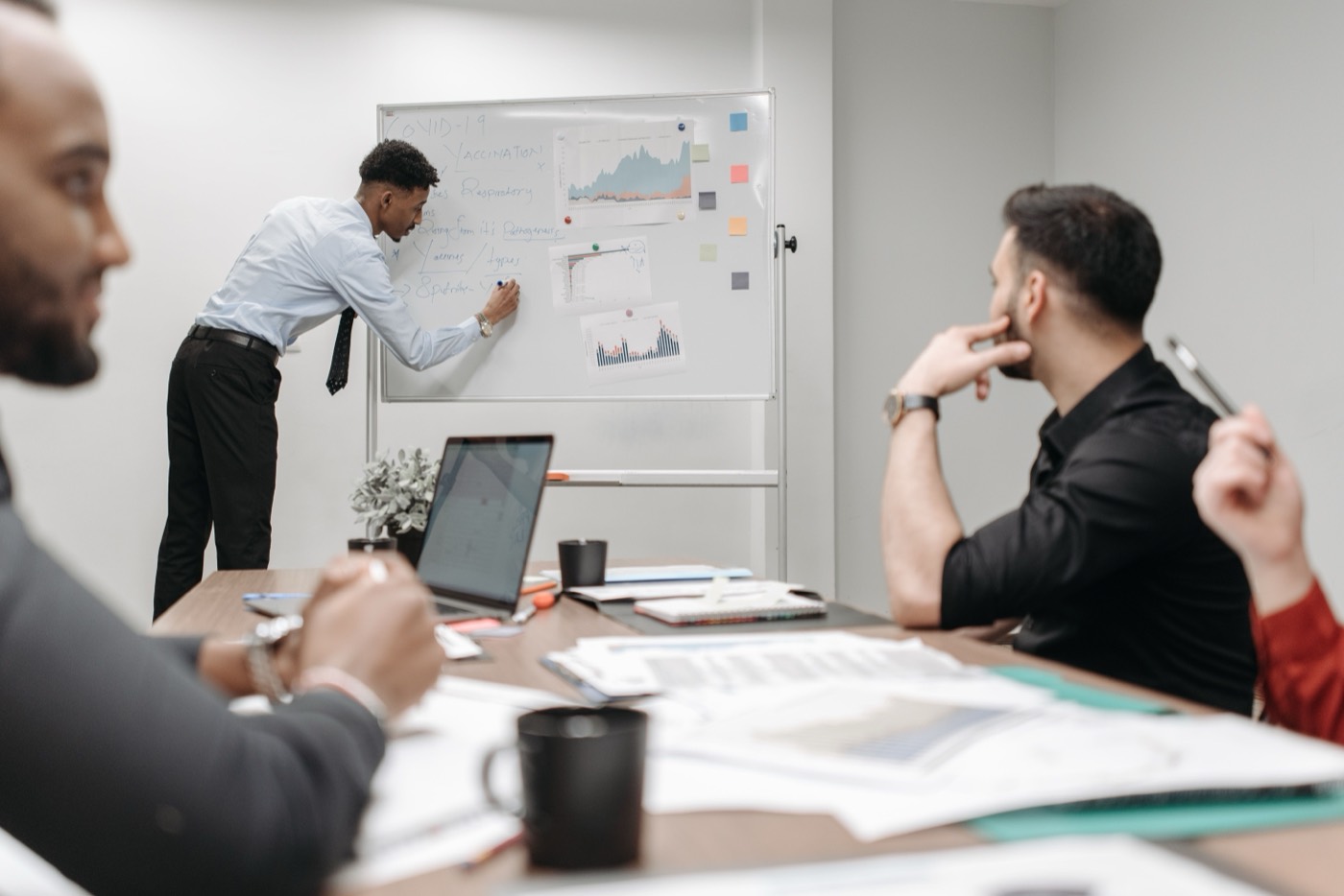 Strategist walking the team through growth charts on a whiteboard